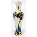 NICOLA SLANEY FOR MOORCROFT; a slender vase decorated with flowers against a white ground, height