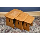 A nest of three Ercol style rectangular occasional tables, on standard end supports, height 45cm,