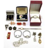 A small collection of costume jewellery to include brooches, earrings and fashion watches.