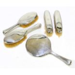 WILLIAM COMYNS & SONS LTD; a George V hallmarked silver five piece dressing table set with