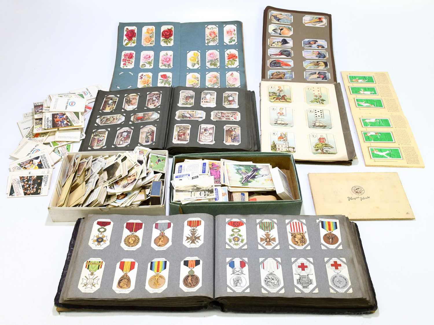 A collection of assorted cigarette and tea cards, various sets, to include military medals, insects,