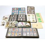A collection of assorted cigarette and tea cards, various sets, to include military medals, insects,