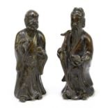 A pair of 19th century Chinese cast bronze figures of sages, tallest 22.5cm.