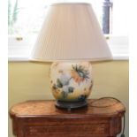 A pair of modern good quality porcelain lamps of bulbous form with floral decoration and conical