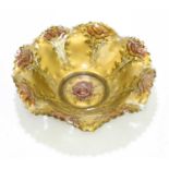 GOOFUS; a moulded glass bowl decorated with roses on a gilt ground, diameter 24cm.