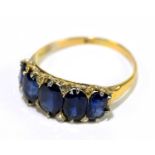An 18ct gold and sapphire five stone ring, with five graduated oval sapphires, size R, gross weight