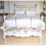 An antique white painted iron metal bed frame (Super King), with heightened brass rails and