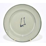 WALTER MOORCROFT; a plate decorated in the 'Sails' pattern on a celadon ground, diameter 19cm.
