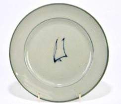 WALTER MOORCROFT; a plate decorated in the 'Sails' pattern on a celadon ground, diameter 19cm.