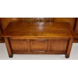 ROYAL OAK FURNITURE COMPANY; a reproduction oak bedding box with three panelled front on square