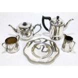Two silver plated teapots with a sugar bowl, a cream jug and a dish.