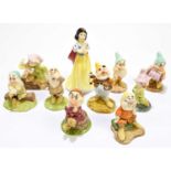 ROYAL DOULTON; a group of seven Snow White and the Seven Dwarfs figures to include 'Snow White' SW9,