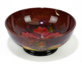 MOORCROFT; a 'Hibiscus' pattern flambe bowl, impressed marks and painted Walter Moorcroft