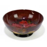 MOORCROFT; a 'Hibiscus' pattern flambe bowl, impressed marks and painted Walter Moorcroft
