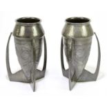 ARCHIBALD KNOX FOR LIBERTY & CO; a pair of Tudric pewter bomb vases with embossed stylised foral
