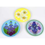 SALLY TUFFIN FOR DENNIS CHINAWORKS; three footed circular dishes, each decorated with floral motifs,