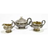 X CHARLES FOX; a George IV hallmarked silver three piece tea service, profusely decorated throughout