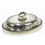 MAUBER, NEW YORK; an American sterling silver oval entree dish and cover with scrolled detailing,