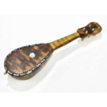 A miniature tortoiseshell mandolin, 20cm.