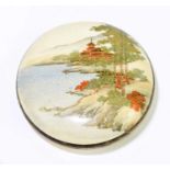 A Japanese Satsuma Meiji period circular bowl and cover, the lid decorated with a landscape,