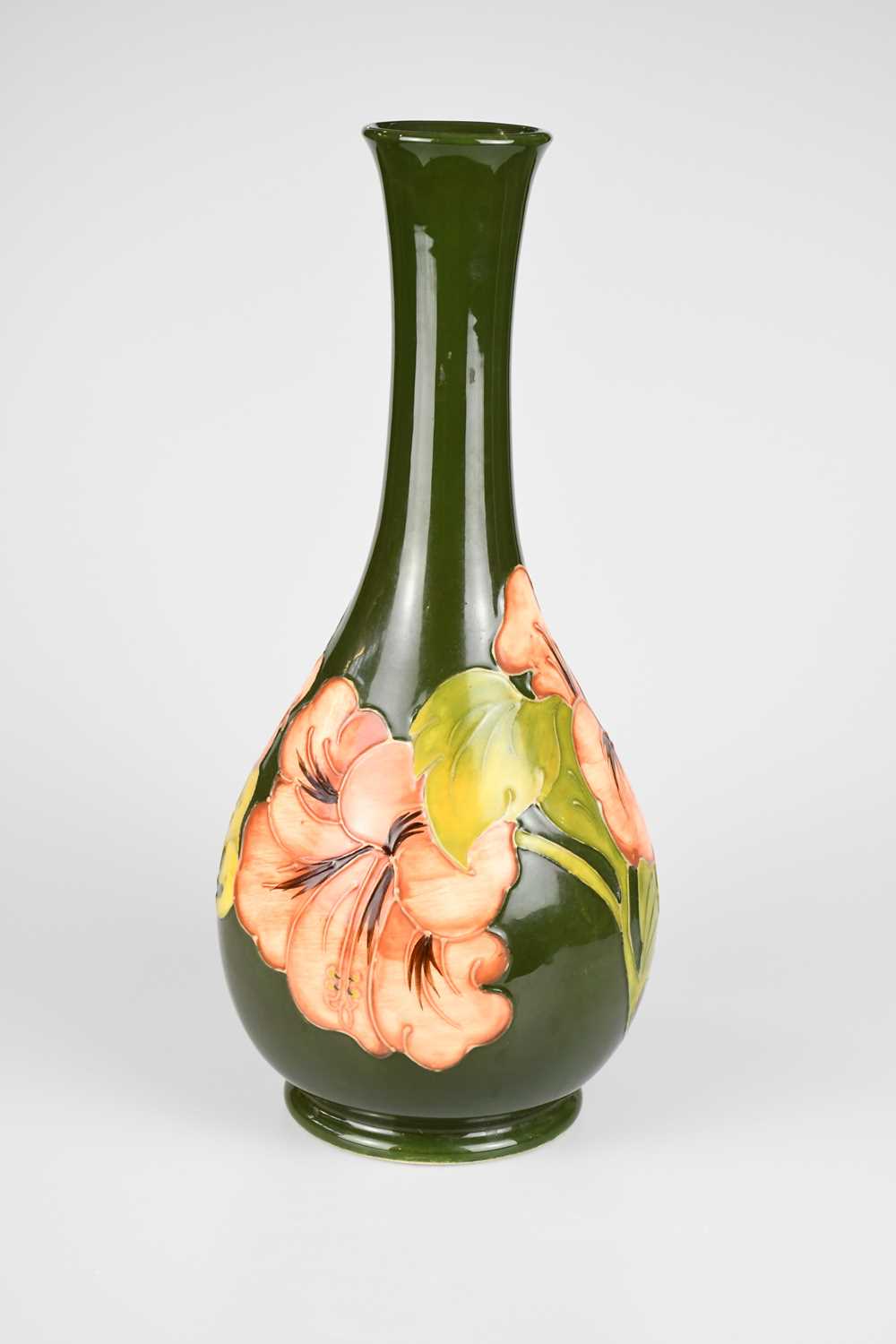 MOORCROFT; a baluster shaped vase decorated in the 'Coral Hibiscus' pattern on a green ground, - Image 2 of 4