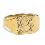 A 9ct yellow gold signet ring with engraved initials ‘PR’, approx size R, approx weight 3.4g.