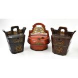 Two Chinese metal bound teapot caddies of tapering form with carved detail, height 32cm, together