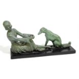 An Art Deco style bronzed resin sculpture of a seated maiden beside a borzoi dog on a black plinth