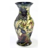 NICOLA SLANEY FOR MOORCROFT; a vase with flared neck decorated in the 'Hellebore' pattern, signed in