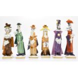 MEISSEN; a collection of six porcelain figures by Peter Strang, each of Cubist form, on square