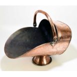 A 19th century copper and brass coal scuttle, with swing handle.