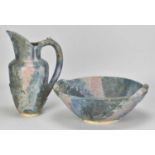 † SARAH MIDGLEY; a stoneware jug and bowl set covered in polychrome glaze with relief decoration,