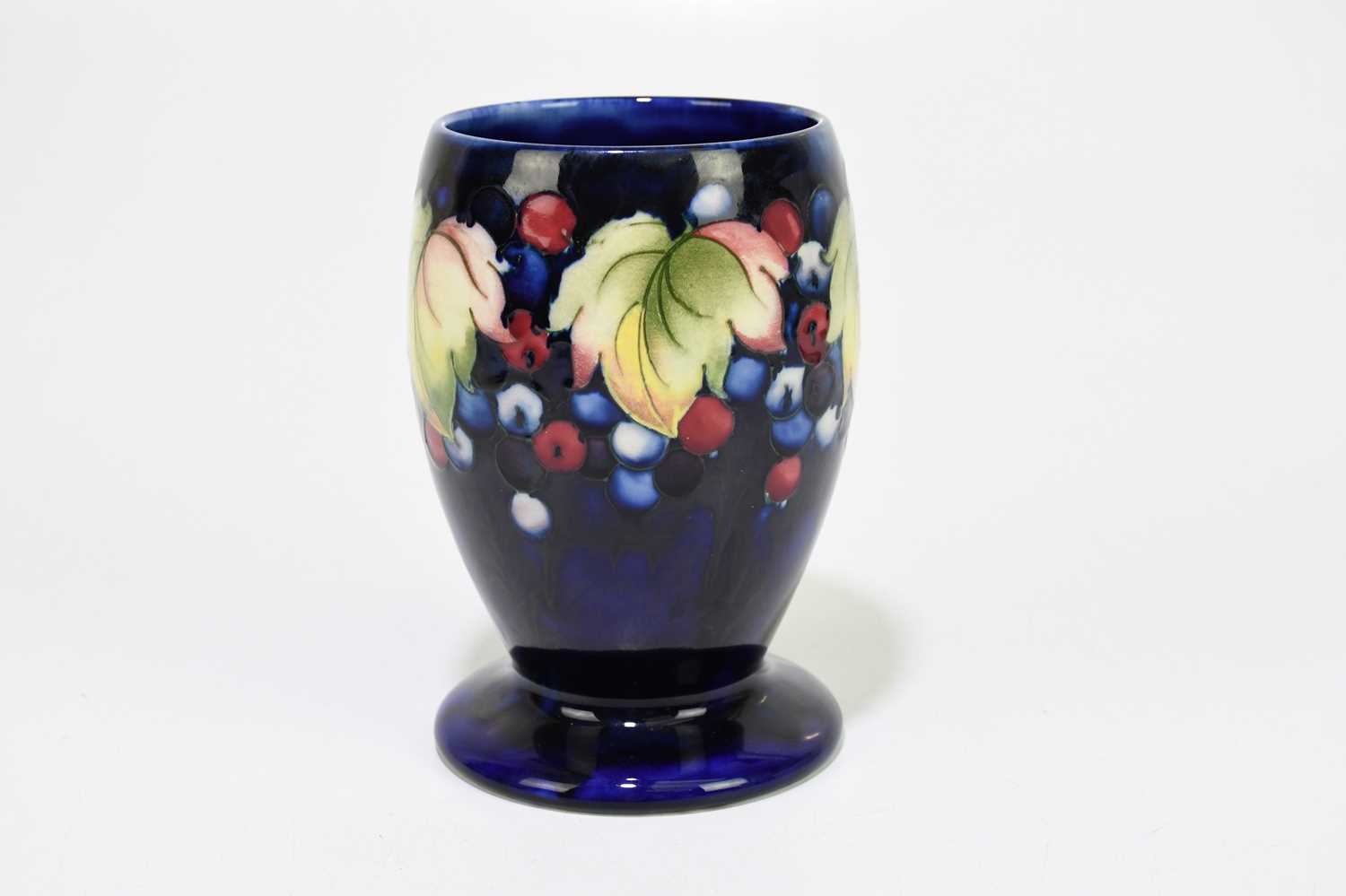 MOORCROFT; a 'Leaf and Berry' pattern vase, with a blue ground, impressed marks and painted Walter - Image 3 of 5