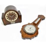 An ealy 20th century walnut aneroid barometer, height 54cm, together with an oak case mantel clock.