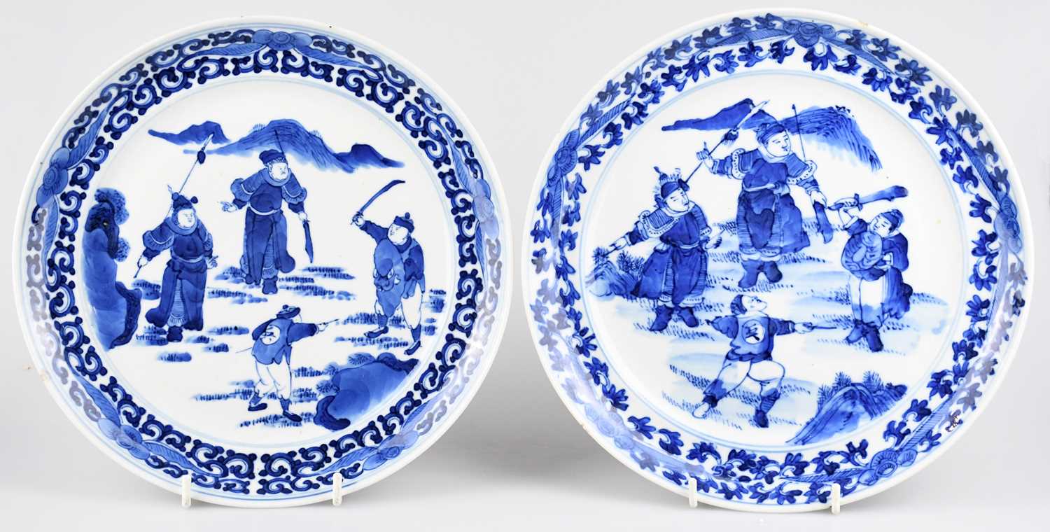 A near pair of 19th century Chinese blue and white Proc plates of circular form decorated with