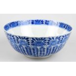 A 19th century Chinese blue and white porcelain footed bowl, painted with floral sprays on a