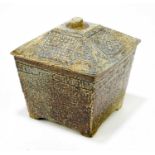 ALISON BRIGDEN FOR TROIKA POTTERY; an unusual lidded bowl with incised decoration on four feet,