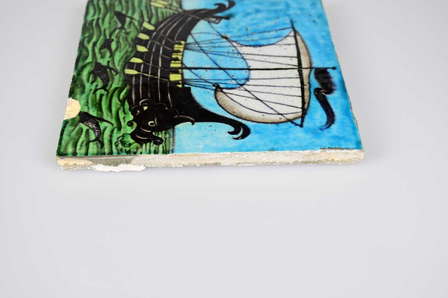 WILLIAM DE MORGAN; an Art Pottery tile painted with a galleon ship with six sailors with paddles - Image 6 of 6