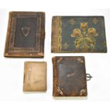 Four Victorian and later photograph albums, the small album containing various military