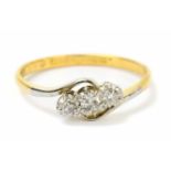An 18ct yellow gold three stone ring, size M, approx weight 2.1g.