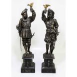 A pair of 19th century cast spelter figures, each holding a bird, on marble bases, height 66cm.