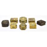 Eight Chinese brass and bronzed snuff boxes of different shape and sizes, each relief decorated with