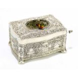 A late 20th century German sterling silver singing bird box, decorated with cherubs, foliate scrolls