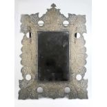 A pierced Eastern copper mirror, 38 x 54cm.