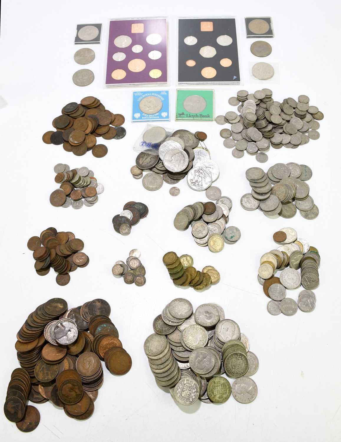 A quantity of assorted coins to include commemorative crowns, half crowns, florins, silver