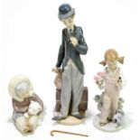 LLADRO: a ceramic figure of Charlie Chaplin, no.5233, with cane, with two further Lladro figures