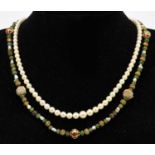 A baroque pearl, green hardstone and enemelled and yellow metal bead necklace, with a Ciro pearl