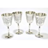 CHARLES GREEN & CO; a set of four Elizabeth II hallmarked silver goblets, with engraved foliate