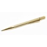 ROSE; a 9ct gold propelling pencil, with engine turned decoration, total weight 22.2g.