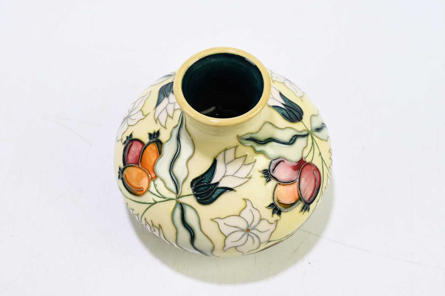 MOORCROFT; a squat vase decorated with floral sprays on an ivory ground, height 10cm.Condition - Image 5 of 6